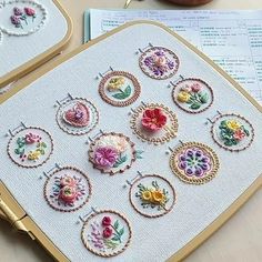 there are many embroidered designs on the table