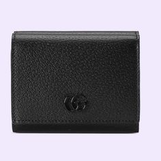 Authentic Gucci Gg Marmont Trifold Wallet This Gg Marmont Tri-Fold Wallet In Black Leather Features Six Card Slots And Three Open Pockets, Complete With Snap-Button Closure. The Double G Appears In Tonal Black Resin, Resulting In A Modern Interpretation Of Historical Hardware. Black Leather Black Resin Hardware Double G Inside: 4 Open Pockets, 1 Bill Compartment Outside: Snap Pocket, Back Zipper Pocket Snap-Button Closure Closed: 4.3"W X 3.3"H X 1.4"D Open: 9.4"W X 4.3"H Made In Italy 8 Luxury Compact Trifold Wallet, Luxury Trifold Wallet For Evening, Luxury Evening Trifold Wallet, Luxury Gucci Wallet With Coin Pocket, Gucci Bifold Wallet For Formal Occasions, Gucci Bifold Evening Wallet, Gucci Rectangular Evening Wallets, Gucci Evening Wallets Rectangular, Elegant Gucci Bifold Wallet