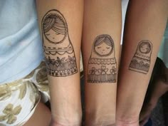 two girls with matching tattoos on their arms