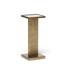 a gold pedestal with a glass top