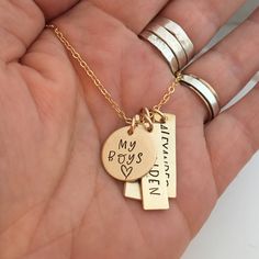 "My Boys - hand stamped personalized necklace - mothers necklace - Gift for Mom of Boys - Gold Filled Mommy Necklace - Gold Mom Necklace 1 5/8\" gold filled disc stamped \"my boys\" 1\" gold filled rectangle name tags (You choose how many name tags you need from the drop down box) The charms hang from a gold filled cable chain. Info to include in the notes to seller during checkout: names/words to stamp on each charm length of chain (16, 18 or 20 inches) As with all hand stamped jewelry, each pi Gold Hand Stamped Dog Tag Jewelry, Hand Stamped Gold Dog Tag Jewelry, Hand Stamped Round Pendant Charm Necklaces For Mother's Day, Hand Stamped Round Pendant Charm Necklace For Mother's Day, Personalized Dog Tag Jewelry For Father's Day, Stamped Dog Tag Jewelry For Gift, Personalized Meaningful Pendant Charm Necklaces, Personalized Meaningful Pendant Charm Necklace, Personalized Meaningful Dog Tag Necklaces