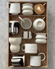 coffee cups and saucers in a wooden box