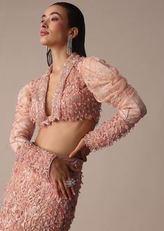 Slip into the epitome of elegance with our peach embroidered fish cut skirt set. A beautiful balance of grace and sophistication the short jacket is designed with intricate self zardosi embellishments. Flaunting a chic fish cut silhouette skirt and draped sleeves on the blouse the rich and opulent artistic embroidery creates a timeless appeal. Dry clean only if required. Slight variation in color is possible due to digital photography. Fitted Sharara With Pearl Embroidery, Glamorous Long Sleeve Set With Pearl Embroidery, Glamorous Fitted Choli With Resham Embroidery, Glamorous Fitted Blouse Piece With Resham Embroidery, Glamorous Long Sleeve Sets With Pearl Embroidery, Elegant Peach Lehenga With Zari Work, Pink Embellished Blouse Piece For Evening, Fitted Silk Choli With Pearl Embroidery, Traditional Evening Choli With Pearl Embroidery