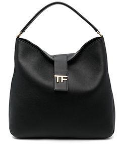 logo-plaque leather tote bag from TOM FORD featuring black, calf leather, grained texture, gold-tone logo plaque, logo stamp to the rear, strap and press-stud fastening, single flat top handle, internal slip pocket and main compartment. Size Info UNI Color Detail Black Made In Italy Material Outer: Calf leather 100% Lining: Polyamide 60% Polyurethane 40% Season One Fall-Winter Season Two Fall-Winter Product bags.. Brand Tom Ford Size And Fit Width 15,75 in / 40 cm Height 14,96 in / 38 cm Depth 3 Black Shoulder Bag With Logo Plaque For Business, Black Business Shoulder Bag With Logo Plaque, Formal Double Handle Shoulder Bag With Logo, Black Shoulder Bag With Logo Plaque, Modern Shoulder Bag With Logo Plaque, Classic Travel Satchel With Logo Hardware, Modern Shoulder Bags With Logo Plaque, Luxury Tote Satchel With Logo Hardware, Business Double Handle Shoulder Bag With Logo