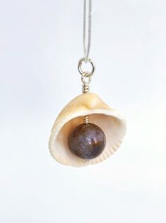 This is a wonderful pendant made of a natural Atlantic seashell and natural Agate. My seashells are harvested on Melbourne beach in Florida. The inner shell has beautiful pink and purple color to it and looks very authentic in combination with agate. The pendant makes a great souvenir from Florida for ocean lovers and sustainable friends.Agate is well known for its calming, soothing effects on the mind, primarily when used over some time. It can help enhance mental clarity and improve concentrat Ocean-inspired Abalone Shell Gift, Handmade Spiritual Shell, Spiritual Shell Necklace Gift, Abalone Shell Necklace As A Gift, Spiritual Handmade Shell Necklace Gift, Handmade Spiritual Shell Necklace Gift, Handmade Spiritual Shell Necklace As Gift, Unique Handmade Shell Gift, Natural Shell Necklace As Gift