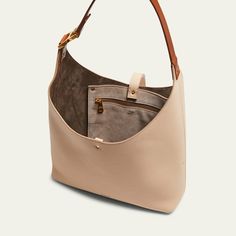 Chloe "Marcie" hobo bag in grained calfskin leather  Shoulder strap  Open top with center leather strap closure  Interior, one zip pocket  Lining: Leather Approx. 8.2"H x 11.4"W x 1.9"D Made in Italy Leather Shoulder Bag With Gold-tone Hardware For On-the-go, Pebbled Leather Shoulder Bag Tote With Leather Handles, Pebbled Leather Tote Shoulder Bag With Leather Handles, Everyday Hobo Shoulder Bag With Gold-tone Hardware, Textured Leather Hobo Shoulder Bag, Luxury Hobo Bag With Leather Lining For On-the-go, Gold-tone Hardware Hobo Shoulder Bag, Classic Textured Leather Crossbody Hobo Bag, Versatile Leather Hobo Bag With Leather Handles