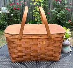 a wooden basket sitting on top of a table