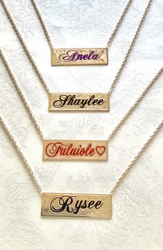 "Nameplate necklace with your name or couple names customized. The plate is made with 14/20 yellow gold filled on both sides. The thickness is 1.02mm. The plate measures 1\"wide by 3\" long. The maximum number of letters is 9. The letters are engraved an enameled in old English or script. The chain is attached to the plate with circle bails. The chain is a gold filled 4.00mm double rope with a lobster claw. The background design is hand engraved with Victorian scrolls or sand finish. The process Anniversary Nameplate Necklace, Anniversary Engraved Nameplate Necklace, Gold Customizable Nameplate Necklace, Gold Engraved Name Necklace Rectangular, Birthstone Nameplate Necklace, Gold Engraved Rectangular Name Necklace, Diamond Nameplate Necklace, Custom Nameplate Necklace In Rose Gold, Custom Rose Gold Nameplate Necklace With Name