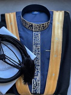 "This full set includes not just the thobe (An exquisite Saudi jubba) but also a pure wool bisht, kufi cap, 100% cotton scarf, and wool agal (igal). Each piece complements the other, creating a harmonious and sophisticated ensemble. This thobe set is perfect for special occasions like a nikah, weddings, Ramadan, Eid, or any moment where making a sophisticated statement is key. Luxurious Fabric: The thobe is expertly crafted using high-quality Japanese anti-static material Intricate Gold Embroidery: Each stitch reflects a commitment to impeccable attention to detail Handcrafted: Every element of the Light Grey Thobe Set is handmade with precision. What's Included: 1. Thobe x 1 2. Bisht x 1 3. 100% Cotton White Scarf (55\") x 1 4. Agal Of Your Choice x 1 5. Skull Cap x 1   Thobe Style: Saudi Elegant Formal Kurta With Traditional Patterns, Formal Fitted Thobe For Eid, Elegant Agbada For Wedding With Traditional Drape, Elegant Wedding Agbada With Traditional Drape, Elegant Fitted Festive Thobe, Festive Elegant Fitted Thobe, Elegant Blue Agbada For Traditional Ceremonies, Elegant Blue Thobe For Traditional Ceremonies, Elegant Kurta With Traditional Drape For Ceremonies