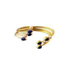 The Jahnavi Bracelet embodies the vibrant essence of the River Ganga with its luxurious blend of contrasting stones set in gold. Featuring custom-cut Lapis lazuli and ivory pearls, it creates a regal and dynamic accessory. Elegant Adjustable Stones Bangle, Elegant Lapis Lazuli Gemstone Bracelets, Elegant Adjustable Bangle With Stones, Luxury Natural Stones Bangle, Luxury Gold Bracelets With Gemstone Accents, Elegant Natural Stones Cuff Bangle Bracelet, Elegant Cuff Bracelet With Natural Stones, Elegant Natural Stone Cuff Bangle, Elegant Natural Stones Cuff Bracelet