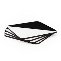 four black and white coasters stacked on top of each other in the shape of squares