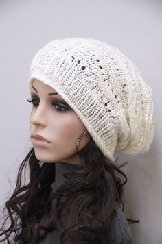 "100% Wool hand knitted hat. This ivory hat features on an interesting shape with irregular patterns and rolled edges. It suits ant outfits style. Color:Ivory Length:11 1/2\" from top to bottom Measurements: 18\" (relaxed) 26\" (stretched) - it can fit any size! Hand wash in cold water with detergent or shampoo and lay flat until dry." Casual White Knitted Bonnet, White Warm Casual Bonnet, Casual Warm White Bonnet, Casual White Bonnet One Size, Casual White One-size Bonnet, Casual Cream Knitted Bonnet, Trendy Warm White Hat, Trendy White Warm Hats, Cream Knitted Beanie One Size