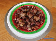 a plate full of food sitting on top of a wooden table