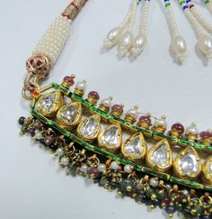 "Vintage antique solid 22 carat Gold 'Katsari' Necklace from 'Mewar state' Udaipur Rajasthan India. Great Handmade Workmanship all over the piece. Beautiful design & seted Rose cut real Diamonds in it. Very nice Red,green & blue color Enamel work at back side of necklace. Attached Ruby, emerald, sapphire & pearl beads in all the Bottom loops. Nice adjustable cord at the back side. Beautiful workmanship Necklace in Good condition,Great for your jewelry collection. Weight-75 Grams (2.6 Traditional Necklaces For Diwali, Traditional Kundan Necklace With Gota Work As Gift, Traditional Kundan Necklace With Gota Work For Festivals, Traditional Kundan Bridal Necklace With Gota Work, Traditional Ceremonial Kundan Necklace With Meenakari, Traditional Necklaces With Gota Work For Festive Occasions, Ceremonial Kundan Necklace With Gota Work, Traditional Festive Necklace With Gota Work, Traditional Necklace With Gota Work For Festivals