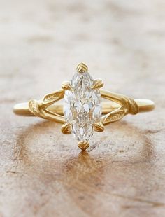 caption:Shown with 1ct marquise diamond in 14k yellow gold Floral Engagement Ring With Wedding Band, Teardrop Gold Engagement Ring, Western Inspired Engagement Rings, Simple Timeless Engagement Rings, Beach Engagement Ring, Vintage Inspired Engagement Ring, Marquise With Side Stones, Asymmetrical Wedding Ring, Engagement Rings Marquis