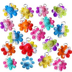 many different colors of teddy bears are in the shape of keychain charms on a white background