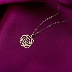 Embrace the timeless beauty of our 14K Solid Gold Adjustable Rose Flower Necklace for Women. This exquisite necklace features a delicate rose flower pendant crafted from solid 14K gold. The adjustable chain allows for a perfect fit, ensuring both comfort and style. The rose symbolizes love, beauty, and femininity, making it a meaningful and elegant accessory. Whether worn for everyday elegance or to add a touch of romance to special occasions, this necklace is a stunning choice. Capture the esse Gold Rose Pendant, Elegant Rose Flower Pendant Charm Necklaces, Elegant Rose Gold Flower Charm Necklaces, Elegant Rose Gold Flower Charm Necklace, Elegant Rose Design Charm Necklace For Gift, Elegant Rose Design Charm Necklace Gift, Classic Rose Gold Flower Shaped Jewelry, Elegant Rose Necklaces With Clavicle Chain, Elegant Rose Flower Necklace With Rose Design