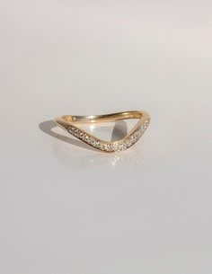 a yellow gold ring with two rows of diamonds