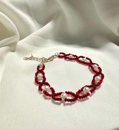 Our delicate bracelet is very suitable for daily wear.It can be also be given to girlfriends,daughters,mothers,stepmom,or as a birthday gifts to friends.  🦋Main materials :4mm white pearl Beads,2mm red glass Beads. 🦋My bracelets is about 6-7 inches without extension chain so they can be suitable for most people's wrist,and if you had big wrist,still no problem with 2.5 inches extension  🦋About packaging: Our bracelet is packaged in a simple white box. 🦋About shipping: we ships the order next day, If you have any question,please feel free to contact me. 🦋Thank you for visiting my shop, I hope you enjoy your jewelry as much as we enjoy making it for you. Please visit my shop page for many more exciting items. Check back frequently as new designs are added regularly.    https://assalijew Bohemian Pearl Beaded Bracelets, Pearl Beaded Bracelets For Beach With Tiny Beads, Beach Pearl Beaded Bracelets With Tiny Beads, Beaded Pearl Bangle Bracelet, Bohemian Beaded Pearl Bangle Bracelet, Bohemian Pearl Bracelet With Spacer Beads For Jewelry Making, Pearl Chain Beaded Bracelets As Gift, Beaded Pearl Crystal Bracelet For Gift, Beaded Pearl Bracelet For Party