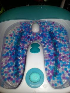 a child's bathtub with blue and purple bubbles