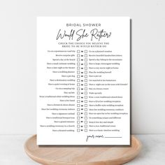 the bridal shower checklist is shown on a wooden plate with a white background