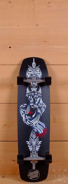 a skateboard with an image of a tiger on the front and back wheels is hanging up against a wooden wall