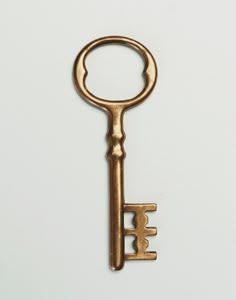 an old golden key on a white background