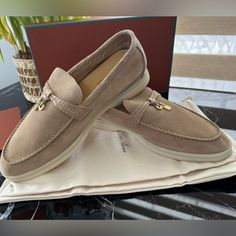 Loro Piana Soft Suede Loafers. The Soles Are Made From Rubber. They Are Perfect For The S-F. Product Stitching On The Front Upper Non-Slip White Soles With Lp Monogram 100% Suede Specific Features: 100% Caiman Skin; Lining: 100% Calfskin; Soles: 100% Rubber. Brand New With Receipt, Dust Bag And Box. Elegant Low-top Slip-ons With Textured Sole, Loro Piana Shoes Outfit Summer, Elegant Suede Boat Shoes With Leather Sole, Elegant Closed Toe Moccasins With Suede Lining, Elegant Boat Shoes With Rubber Sole And Almond Toe, Beige Almond Toe Moccasins For Galas, Elegant Almond Toe Boat Shoes With Rubber Sole, Elegant Slip-on Low-top Moccasins, Elegant Low-top Slip-ons