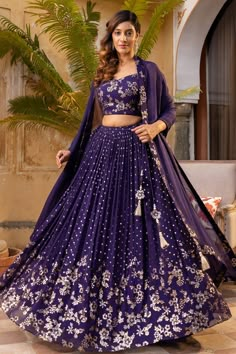 Purple georgette lehenga with butti and floral sequins embroidery. Comes with a padded bustier and a dupatta.
Components: 3
Pattern: Embroidered
Type Of Work: Butti, Floral sequins
Neckline: V Neck
Sleeve Type: Sleeveless
Fabric: Georgette
Color: Purple
Other Details: 
Hand attached lining
Approx Lehenga length : 42-43 inches
Closure :
Blouse : Back hooks
Lehenga : Drawstring
Occasion: Wedding - Aza Fashions Lehenga Purple, V Neck Lehenga, Elegant Lehenga, Purple Lehenga, Lehenga Pattern, Simple Lehenga, Desi Wedding Dresses, Diana Penty, Anamika Khanna