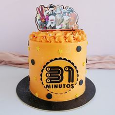 a yellow cake decorated with cartoon characters on top