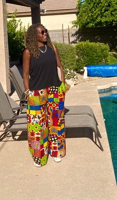 New loose African print pants, wide-leg made from African prints 100% cotton with no stretch. Our Ankara pants for women are very versatile, easy to wear, and comfy style. These African wax pants will be made loose fit for you upon ordering.   Features hidden side pockets. *Listing is for pants ONLY* Click below for the matching top:  https://www.etsy.com/listing/1322210044/mani-linen-kimono-linen-kimono-robe?click_key=6d282701f5fcd54db69a73a37cc3fa815256bb5b%3A1322210044&click_sum=16d87e3d&ref=shop_home_active_6&frs=1&sts=1 MEASUREMENT GUIDE:  For your best fit please provide: Waist measurements=Measure around your natural waist. Hip measurements= Inseam=Take your inseam by measuring between your crotch and hem. Your Height= - [ ] Orders; Once your order is placed with us, you will receiv Summer Cotton Printed Harem Pants, Cotton Printed Pants For Vacation, Multicolor Printed Wide Leg Vacation Pants, Multicolor Printed Wide Leg Pants For Vacation, Vacation Multicolor Printed Wide Leg Pants, Multicolor Pants Loosely Fitted For Vacation, Relaxed Fit Straight Printed Pants, Multicolor Printed Straight Leg Pants, Multicolor Printed Cotton Bottoms