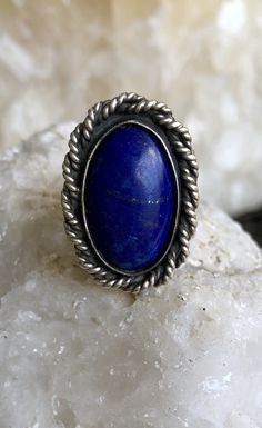 Sterling Silver Blue Lapis Lazuli Native American Vintage Ring Face of ring measures over 1 inch tall Ring size 8 Oval Nickel-free Blue Turquoise Ring, Adjustable Blue Oval Jewelry, Bohemian Blue Oval Ring, Blue Lapis Lazuli Oval Jewelry, Blue Bohemian Jewelry With Metal Ring, Bohemian Blue Jewelry With Metal Ring, Adjustable Blue Sapphire Open Ring, Blue Large Stone Ring Jewelry, Blue Lapis Lazuli Cabochon Rings