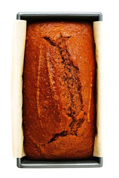 a close up of a loaf of bread in a pan on a white background,