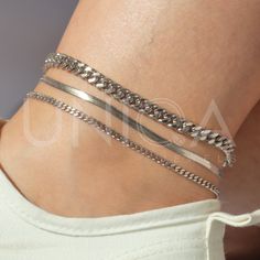 a) Snake chain anklet - 3mm b) Curb chain anklet - 3mm c) Curb chain anklet - 6mm These waterproof chain anklets will be your new fave staple all season long. high quality waterproof anklets, lead free, hypoallergenic ankle brecelet★ --------------------------------- ► PRODUCT DETAILS * Hypoallergenic Stainless Steel * This piece is WATERPROOF * Won't turn skin green * Won't irritate skin * Also unlike Sterling Silver, DOESN'T TARNISH --------------------------------- ► PACKAGING / GIFT BOX All jewelry is carefully packed in our signature UNIQA boxes. To reduce waste, we often put an order with multiple pieces in one or two gift boxes. If you would like your order to be boxed separately or if only part of your order is intended as a gift, please leave a note at checkout and we'll be happy Minimalist Summer Anklets As A Gift, Minimalist Summer Anklets For Gifts, Trendy Silver Jewelry For Summer, Minimalist Summer Anklets As Gift, Adjustable Metal Anklets For Summer, Dainty Adjustable Chain Anklets For Summer, Adjustable Chain Bracelet Summer Gift, Adjustable Chain Bracelet As Summer Gift, Adjustable Chain Bracelet For Summer Gift