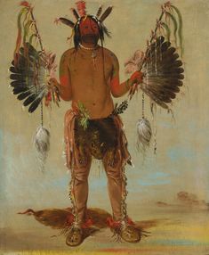 a native american man with feathers on his head and hands, standing in front of a sky background