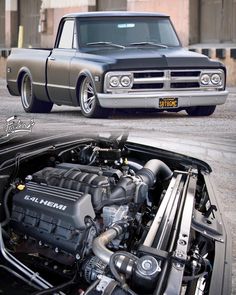 an old pickup truck with its hood up and the engine bay open, parked next to it