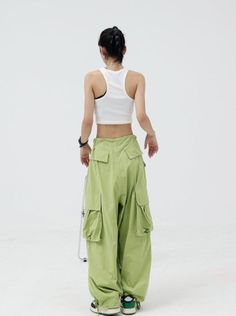 Step out in style with these Baggy Wide Leg Cargo Pants! With a drawstring waist and baggy relaxed fit, these pants are perfect for a cool, casual look. Model is 5'5 wearing M Baggy Wide-leg Parachute Pants With Side Pockets, Baggy Wide-leg Parachute Pants For Streetwear, Hip Hop Baggy Wide-leg Parachute Pants, Streetwear Wide-leg Cargo Pants With Drawstring, Wide-leg Parachute Pants With Drawstring For Streetwear, Black Flared Jeans, Baggy Pants Women, Blue Tube Top, Denim Tube Top