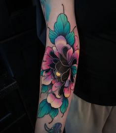 a person with a flower tattoo on their arm