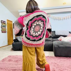 Whimsical Windmill Cardi - A Sustainable Crochet Masterpiece 🌸✨ Embrace warmth, style, and sustainability with our handcrafted Whimsical Windmill Cardi! ✨🌸 Description: Introducing the Whimsical Windmill Cardi, a true embodiment of eco-conscious fashion. Crafted entirely from leftover yarn scraps, this unique piece ensures that no material goes to waste. I was sure to try and pick a pink, black, gray and white color scheme so the colors would blend harmoniously to create a stunning, cohesive design. This chunky, oversized cardigan is not only a statement of style but also a commitment to sustainability. Features: *Hand-Crocheted Artistry: This cardi is meticulously crafted by hand, ensuring a unique and personal touch in every piece. *Sustainable Design: Made exclusively from leftover ya Bohemian Yarn Outerwear For Winter, Hand Knitted Bohemian Pink Sweater, Pink Hand Knitted Bohemian Sweater, Pink Bohemian Hand-knitted Sweater, Pink Bohemian Hand Knitted Sweater, Pink Bohemian Crochet Outerwear, Bohemian Hand Knitted Pink Cardigan, Pink Bohemian Knitted Cardigan, Handmade Artisan Winter Outerwear