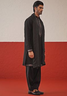 Embrace timeless elegance with Black Kurta. Crafted from luxurious Georgette, the kurta features intricate resham and sequinned embroidery on the yoke, daman, and cuffs. Paired perfectly with matching patiyala pants and an embroidered dupatta. Ideal for Cocktail parties. Composition : Kurta, Patiyala & Dupatta : Viscose Georgette Care: Dry Clean Only and Vacuum Storage This product can be customized for sleeves, length and colour Delivery : 2-4 weeks as the product is hand crafted. Check Size Gu