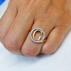 Our Cutoff Date for Christmas delivery is Sunday Dec. 13, 2020All Order placed after this date will be completed for mid January delivery.A completely customizable ring with your choice of initial, in your choice of 14k yellow, rose, or white gold, and also choice of chain length! **FREE SHIPPING**Features:~14k Yellow Gold ~This Ring weighs Approximately 3.0 Grams (will vary slightly with initial)~The Initial with the Diamond Halo measure 0.575 inch in diameter ~This ring has 28 Full brilliant c Luxury White Gold Initial Ring With Single Diamond, Luxury Engagement Ring With Initials, Anniversary Cubic Zirconia Rings With Initials, White Diamond Initial Ring For Anniversary, Personalized White Diamond Ring, White Diamond Initial Ring As Gift, White Diamond Initial Ring For Gift, Round Diamond Ring With Initials For Anniversary, Initials Diamond Ring