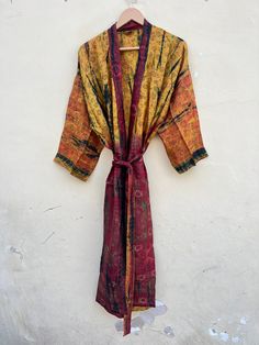 THE SILK STORE INDIA PRESENTING BEAUTIFUL SILK TIE DYE KIMONO DRESS TIE DYE KIMONO WITH POCKET . This stunning Tie dye Kimono is made from Silk fabric. The dress is full sleeve and ankle length with a loose fit making it perfect for different occasions. This gorgeous dress is hand dyed using traditional techniques. The fabric is breathable, light weight and sustainable. Made with luxuriously soft rayon with impeccable Japanese craftsmanship, this blove the knee length women's robe with matching belt is perfect both as a valued gift or a sumptuous everyday treasure just for you. These robes are perfect for bridesmaids gifts, birthday gifts, and perfect gifts for girls who are in college Details : * PRODUCT SPECIFICATION * FABRIC : SILK FABRIC * SIZE : US 14 - 20 * LENGTH : 47'' INCH / 120 C Long Multicolor Silk Kimono, Long Tie-dye Kimono For Vacation, Spring Beach Tie-dye Kimono, Bohemian Long Tie-dye Kimono, Bohemian Tie-dye V-neck Kaftan, Women's Robe, Tie And Dye, Silk Kimono, Pajama Robe