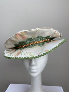 New women's Renaissance Medieval Elizabethan Victorian cream brocade brim hat cap size small. This stunning brim hat is embellished with a green lace trim secured by a salmon cord. Brim is 3" wide embellished with green trim. Great for your next theme party, stage production or Renaissance Faire. Sales final. New not worn. Curved Brim Costume Hat, Costume Hat With Curved Brim, Brimmed Costume Hats And Headpieces, Curved Brim Top Hat For Kentucky Derby Costume, Adjustable Costume Bonnet, Fitted Cap Style Mini Hat For Costumes, Adjustable Wide Brim Mini Hat For Costumes, Victorian Brimmed Costume Hat, Victorian Brimmed Costume Hats And Headpieces