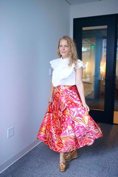 Bold and Beautiful! The Candace midi skirt is sure to turn heads this season. With her bright pink and orange colors and stunning floral pattern you are sure to make a statement. Style It + Finish the LookYou can style this with any top and look fabulous whether it's a graphic tee, a silky blouse or your nicest sweater. Consider wearing sequins for a sparkly holiday, event or date night look! Style FeaturesBack Zipper Size + FitSHC babe Emily is 5’1” and in a smallStock Model note Height 5'8" we Multicolor Floral Print Midi Skirt, Multicolor Floral Midi Skirt, Multicolor Midi Dress For Spring, Spring Floral Print Asymmetrical Skirt, Pink Relaxed Dress With Ruffled Skirt, Multicolor Midi Skirt Dress For Summer, Flared Pink Maxi Skirt With Floral Print, Pink Flared Maxi Skirt With Floral Print, Chic Orange Floral Print Skirt