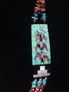 "Native American Indian, Santo Domingo Pueblo artist Raymond Rosetta's unusual handmade vintage multi-stone Corn inlay, multi-strand necklace, with turquoise, purple & orange spiny oyster, mother of pearl, jet, pin shell (backing) & sterling silver beads, including handmade stamped cones at the end before adjustable finish... Beautiful! 2 strands above Corn inlay pendants, 3 strands beneath... Corn inlay pendants are 3 3/8\" x 1 1/8\" x 3/16\" deep. 29-31\" long necklace (short strand) - Unique Turquoise Jewelry With Inlay, Artisan Turquoise Rectangular Jewelry, Rectangular Turquoise Jewelry For Collectors, Collectible Rectangular Turquoise Jewelry, Turquoise Spiritual Jewelry With Inlay, Unique Blue Turquoise Multi-stone Necklace, Unique Blue Multi-stone Turquoise Necklace, Spiritual Turquoise Jewelry With Inlay, Artisan Blue Turquoise Multi-stone Necklace