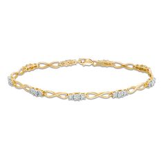 Dress her wrist in an elegant diamond bracelet that complements any attire. Crafted in warm 10K gold, this shimmering design features links with trios of sparkling diamonds alternating with infinity symbol-shaped links. Radiant with 1/10 ct. t.w. of diamonds and a brilliant buffed luster, this 7.25-inch bracelet secures with a lobster claw clasp. Diamond Infinity Bracelet For Anniversary, Infinity Diamond Bracelet For Anniversary, Formal Infinity Diamond Bracelet, Infinity Diamond Bracelet For Formal Occasions, Anniversary Diamond Bracelet With Infinity Design, Infinity Diamond Bracelet With Accents For Anniversary, Rose Ring, Infinity Symbol, Sparkle Diamonds