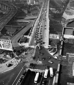 black and white photo of an aerial view of a train station in the 1950's