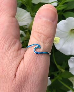 Sterling Silver Wave Ring with Blue Lab Opal | The Life Divine Keep the ocean close and go with the flow. This sterling silver Wave Ring symbolizes the ups and downs we see in life, reminding you to roll with the tides. Wear this ring as a reminder to stay positive, happy and strong regardless of what life throws your way.Cherished for its brilliance, Opal is known as a stone of creativity and vitality. Opal is also a reflective stone of protection, absorbing energies and sending them back to th Minimalist Blue Jewelry For Beach, Ocean-inspired Blue Ring For Gift, Ocean-inspired Blue Ring For Gifts, Ocean-inspired Blue Rings As Gifts, Wave Ring, Go With The Flow, Stay Positive, Ups And Downs, What Is Life About