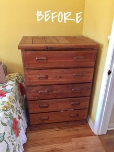 a bed room with a wooden dresser and a wall decal that says before on it