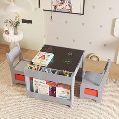 a child's play table and chairs in a room